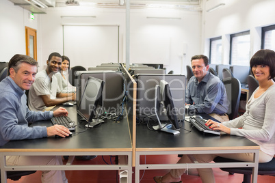 Happy group in a computer room Happy group in a computer room