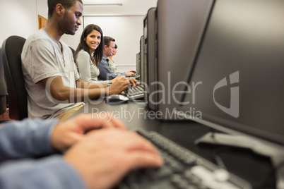 Woman looking up from computer class