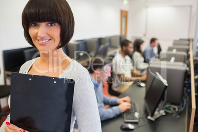 Teacher smiling in computer class