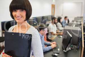 Teacher smiling in computer class