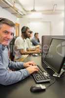 Smiling man in computer class
