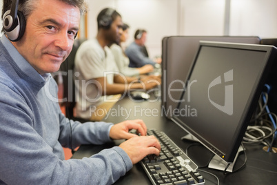 Mature student in computer class