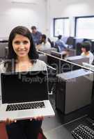 Woman presenting a laptop