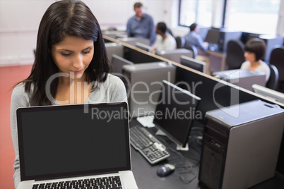 Woman showing a laptop