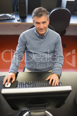 Man in computer class using the computer