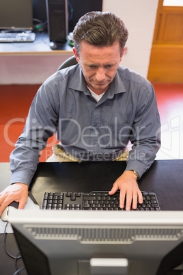 Concentrating man working at the computer