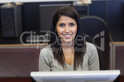Happy woman in computer room