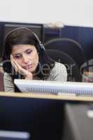 Tired woman in computer room
