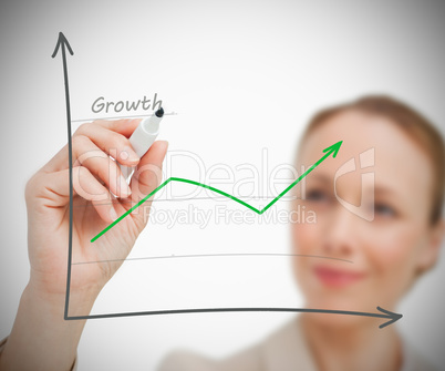 Woman drawing growth graph