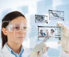 Woman selecting medical images from hologram interface