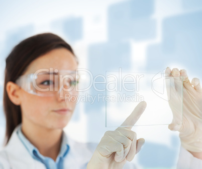 Woman selecting blank pane from hologram