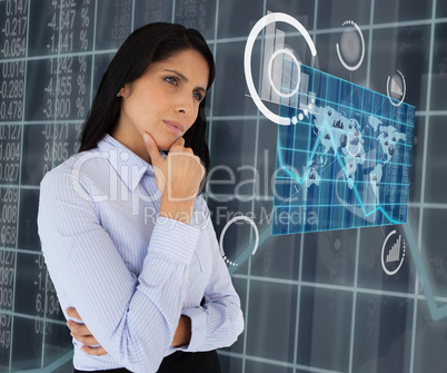 Woman standing thinking looking at world map hologram