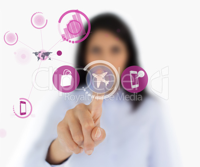 Woman selecting airplane symbol from interface