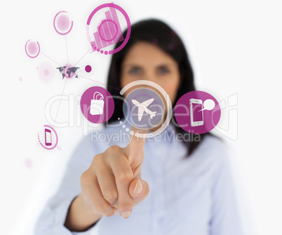 Businesswoman selecting airplane symbol from digital menu