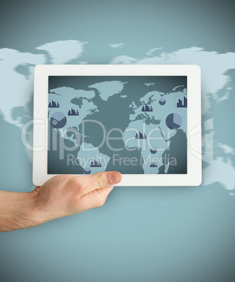 Hand holding a tablet PC showing business world map graphic