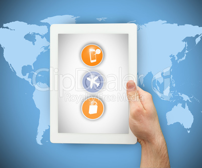 Person holding a tablet PC on world map background