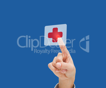 Finger pointing to hospital symbol
