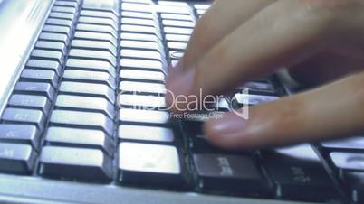 close-up of hands typing on keyboard timelapse