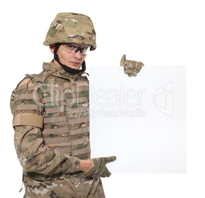 Modern soldier holding a poster