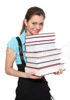 Beautiful student is holding a lot of books