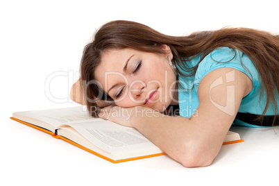 Beautiful student is sleeping on the book