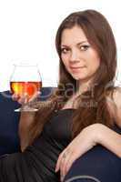 Woman is holding a glass of wine