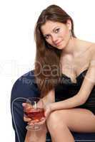 Woman is holding a glass of wine