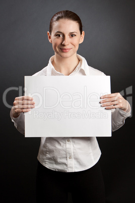 Pretty woman holding white poster