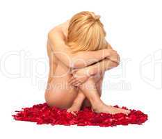 Woman against petals of red roses