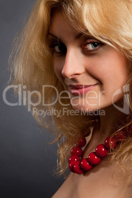 Beautiful woman with red necklace