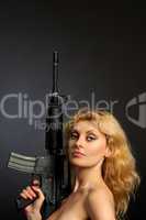 Beautiful girl holding a rifle