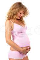 Pregnant woman is caressing her belly