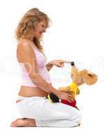 Pregnant woman is playing with a toy