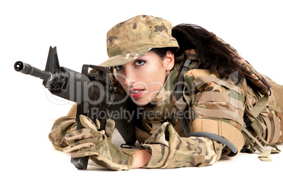 Beautiful army girl with rifle is aiming