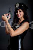 Beautiful sexy police girl with handgun and handcuffs