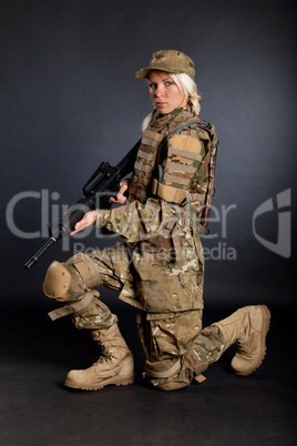 Beautiful army girl with rifle