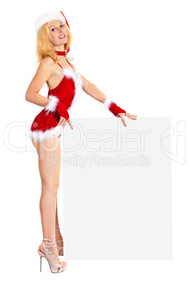 Young sexy Santa woman is holding a poster