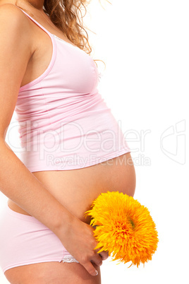 Pregnant woman is caressing her belly