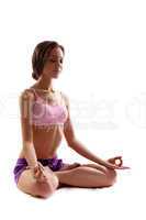 Practicing Yoga. Young woman. Lotus