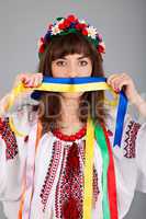 Cute Ukrainian  woman with blue yellow band on the mouth