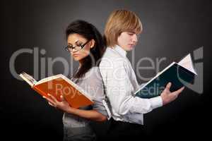 Two students are reading books