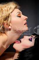 Two young attractive lesbians kissing