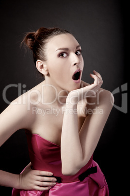 Portrait of a young woman with a astonish expression