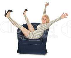Young woman sitting in a navy armchair
