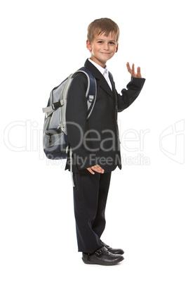 Schoolboy sitting on books