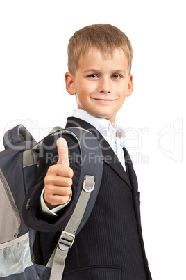 Schoolboy sitting on books