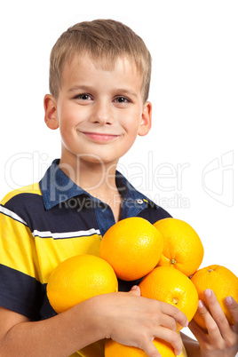 Boy holding oranges