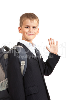 Schoolboy sitting on books