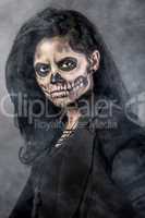 Young woman in day of the dead mask skull. Halloween face art