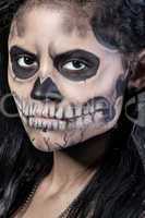 Young woman in day of the dead mask skull. Halloween face art